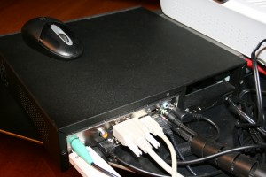 The back The back of the case showing the multitude of connections: PS/2 mouse, USB Wi-Fi Siemens stick, optical S/PDIF output, HDMI, VGA, analog audio out and the DC power cable (the brick is out of view)