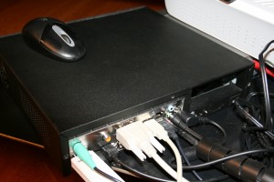 The back of the case showing the multitude of connections: PS/2 mouse, USB Wi-Fi Siemens stick, optical S/PDIF output, HDMI, VGA, analog audio out and the DC power cable (the brick is out of view)